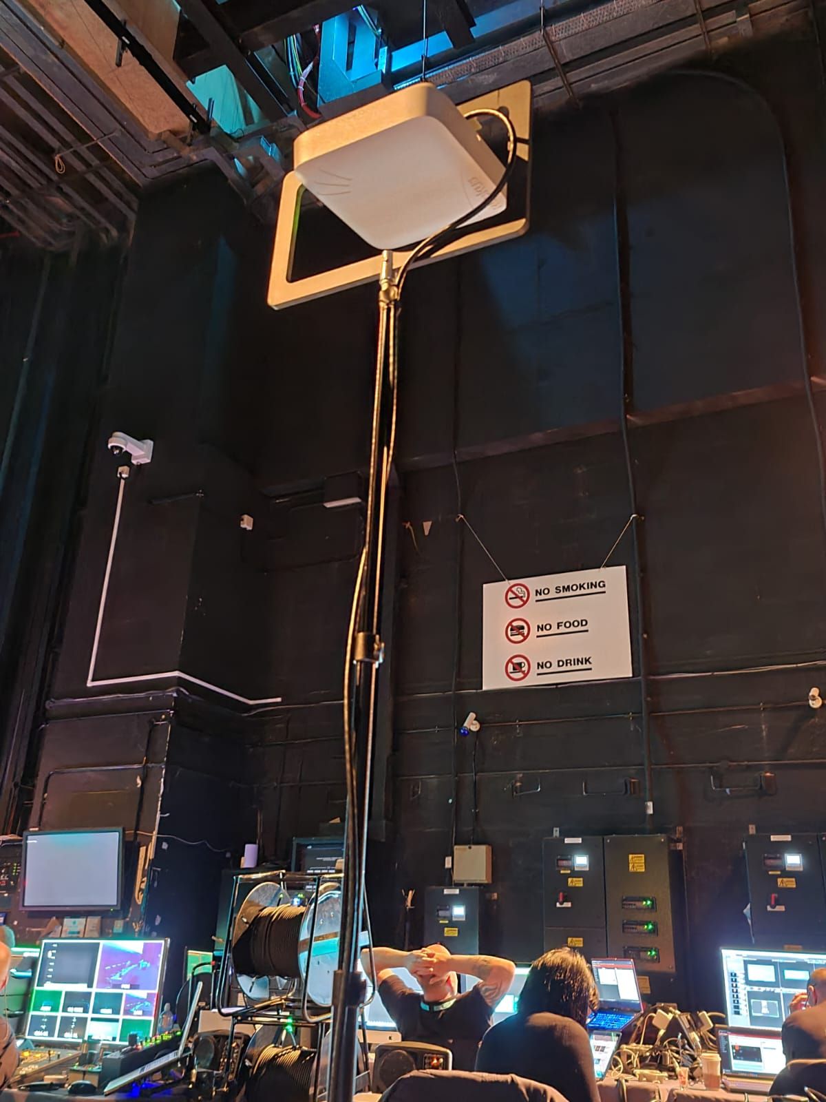 Wireless access point on a stand behind a theatre stage