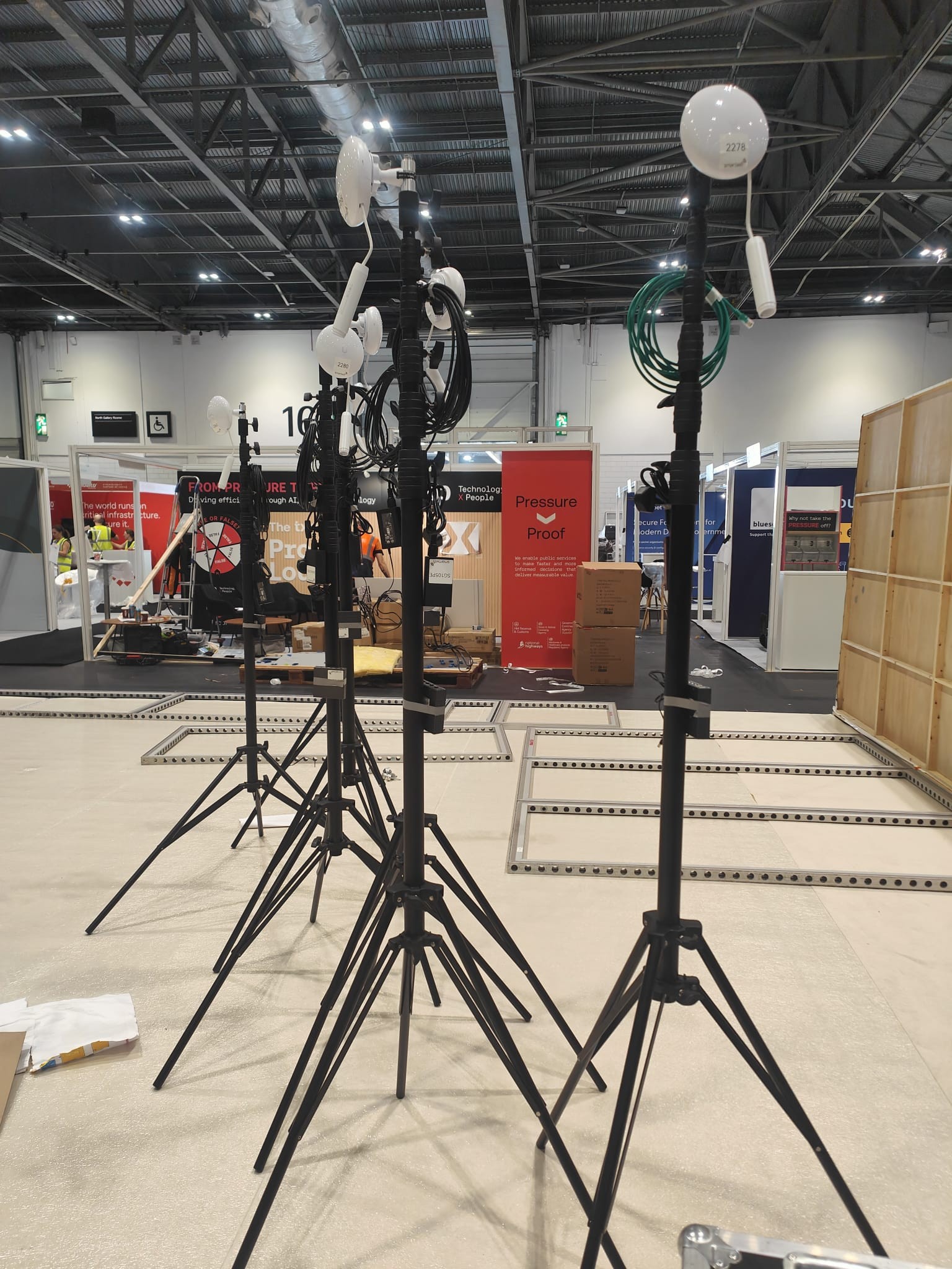 Wireless access points installed on stands during an exhibition build